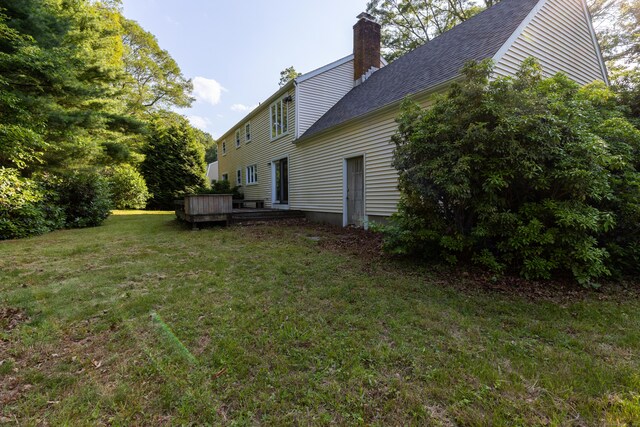 22 Trumbull Rd, Waterford, CT 06385 - view of green lawn with a wooden deck