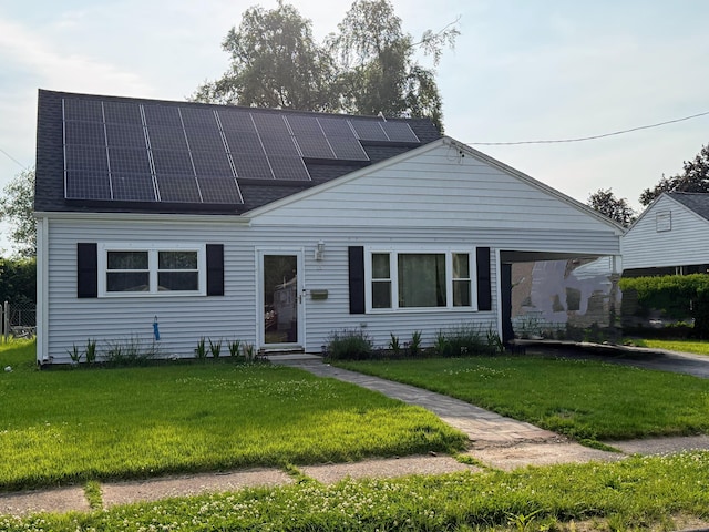 15 Britt Rd, East Hartford, CT 06118 - view of front facade with solar panels, entry steps, a front lawn, and roof with shingles