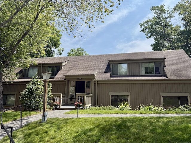 32 Heritage Vlg Unit C, Southbury, CT 06488 - view of front of house featuring a front lawn and roof with shingles