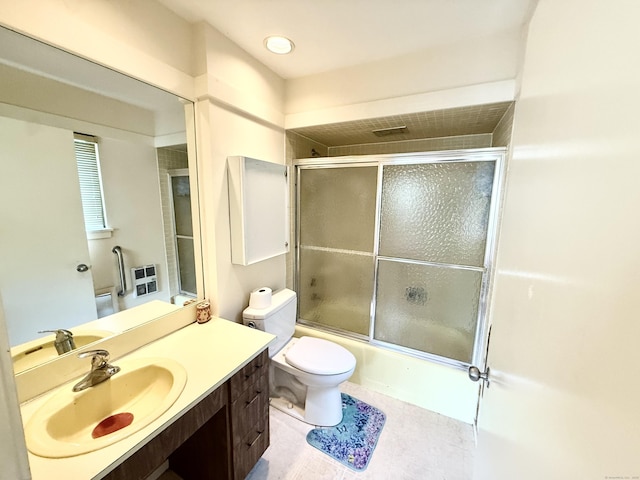 32 Heritage Vlg Unit C, Southbury, CT 06488 - bathroom featuring vanity, bath / shower combo with glass door, and tile patterned floors
