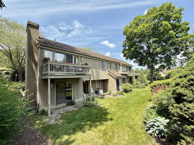 32 Heritage Vlg Unit C, Southbury, CT 06488 - back of property with a chimney and a yard