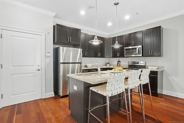 142 E Ave Unit A106, Norwalk, CT 06851 - kitchen featuring stainless steel appliances, dark wood-style flooring, hanging light fixtures, a breakfast bar area, and ornamental molding