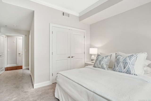142 E Ave Unit A106, Norwalk, CT 06851 - bedroom featuring light colored carpet, a closet, and crown molding