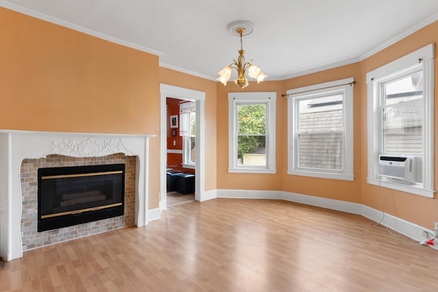 29 Bristol St, West Haven, CT 06516 - unfurnished living room featuring a chandelier, wood finished floors, crown molding, a glass covered fireplace, and cooling unit