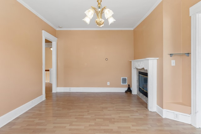 29 Bristol St, West Haven, CT 06516 - unfurnished living room with a chandelier, light wood-style floors, ornamental molding, and a glass covered fireplace