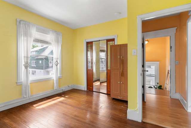 29 Bristol St, West Haven, CT 06516 - spare room with wood-type flooring and baseboards