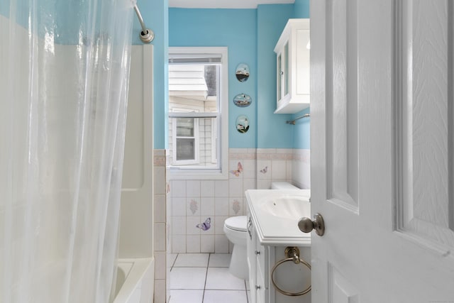 29 Bristol St, West Haven, CT 06516 - bathroom with tile patterned floors, tile walls, wainscoting, shower / bathtub combination with curtain, and vanity
