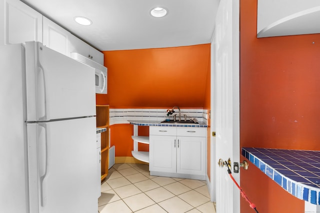 29 Bristol St, West Haven, CT 06516 - kitchen featuring white appliances, white cabinets, recessed lighting, tile counters, and light tile patterned flooring