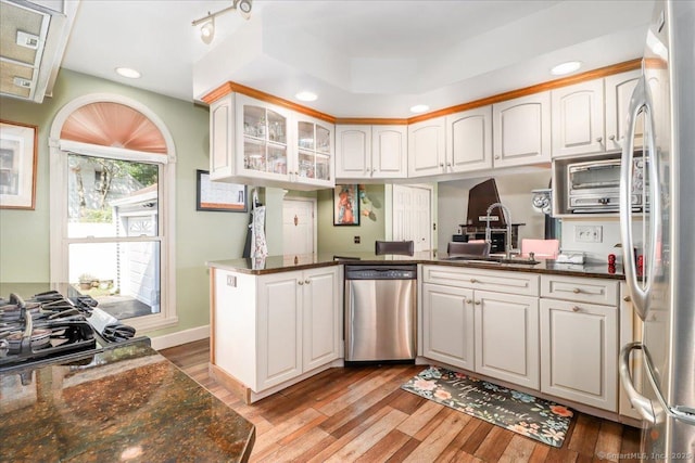 156 Killian Ave, Trumbull, CT 06611 - kitchen with stainless steel appliances, an office area, light wood-style flooring, glass insert cabinets, and white cabinets