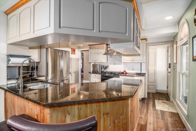 156 Killian Ave, Trumbull, CT 06611 - kitchen with freestanding refrigerator, a peninsula, hardwood / wood-style floors, recessed lighting, and decorative backsplash