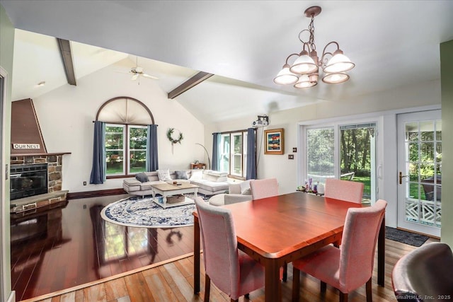 156 Killian Ave, Trumbull, CT 06611 - dining room featuring a ceiling fan, a chandelier, wood finished floors, and a stone fireplace