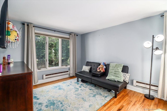 156 Killian Ave, Trumbull, CT 06611 - sitting room with a baseboard heating unit and wood finished floors