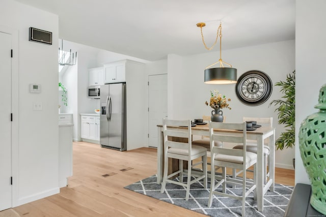 916 N Farms Rd, Wallingford, CT 06492 - dining area featuring light wood finished floors and baseboards