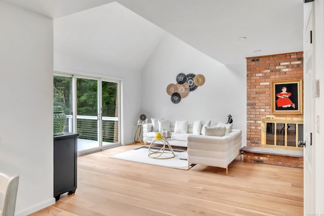 916 N Farms Rd, Wallingford, CT 06492 - living area with a fireplace, light wood-style floors, and vaulted ceiling