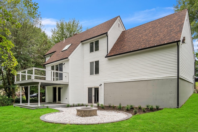 916 N Farms Rd, Wallingford, CT 06492 - rear view of property with a patio area, roof with shingles, a yard, and a fire pit