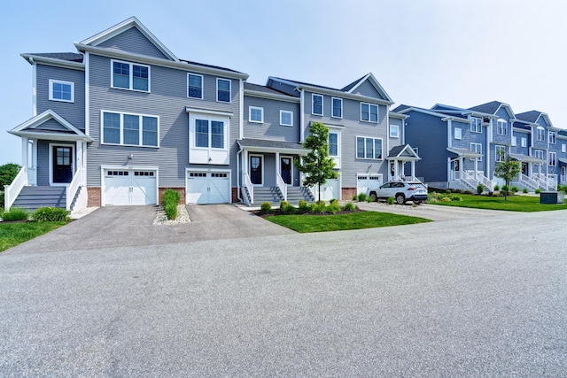 48 Park Ave Unit 48, Stonington, CT 06355 - townhome / multi-family property featuring driveway, an attached garage, and a residential view
