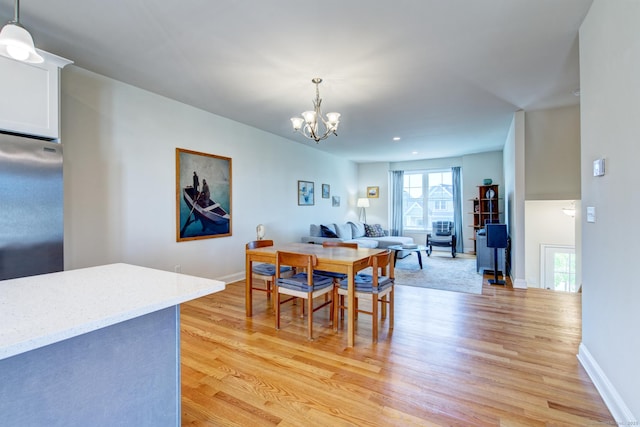 48 Park Ave Unit 48, Stonington, CT 06355 - dining space featuring light wood-type flooring, a chandelier, and recessed lighting