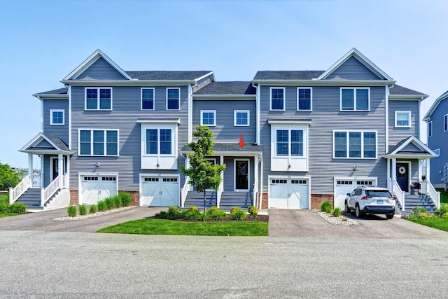48 Park Ave Unit 48, Stonington, CT 06355 - view of property featuring driveway and a garage