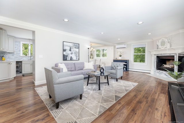 33 Terrace Rd, West Hartford, CT 06107 - living room with a baseboard radiator, an AC wall unit, plenty of natural light, ornamental molding, and wood finished floors