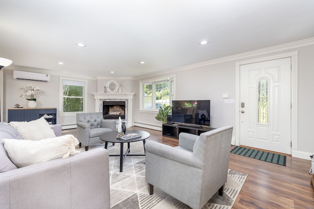 33 Terrace Rd, West Hartford, CT 06107 - living area with a wall mounted AC, baseboard heating, ornamental molding, wood finished floors, and a high end fireplace