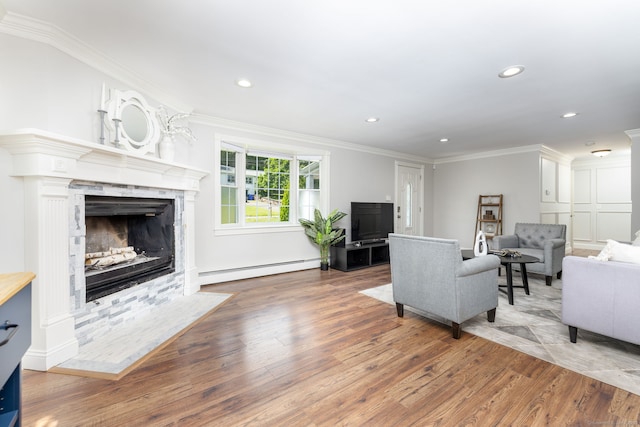 33 Terrace Rd, West Hartford, CT 06107 - living room featuring a baseboard heating unit, hardwood / wood-style floors, a premium fireplace, crown molding, and recessed lighting