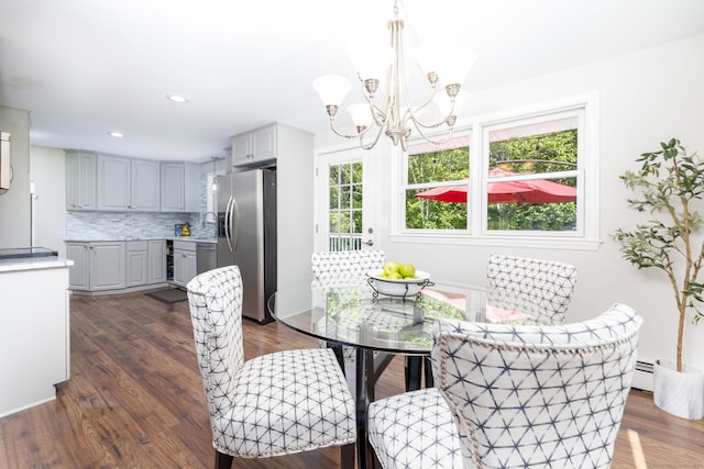 33 Terrace Rd, West Hartford, CT 06107 - dining area featuring a chandelier, dark wood-style floors, a baseboard heating unit, recessed lighting, and wine cooler