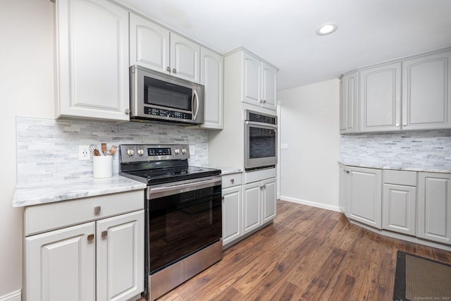 33 Terrace Rd, West Hartford, CT 06107 - kitchen featuring stainless steel appliances, decorative backsplash, dark wood finished floors, white cabinetry, and recessed lighting