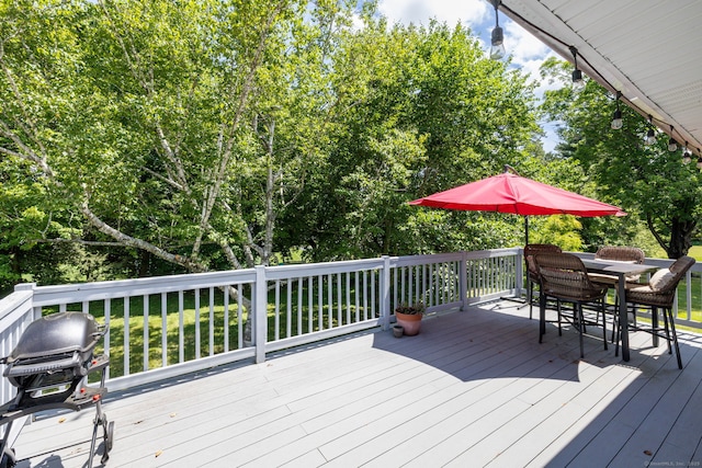 33 Terrace Rd, West Hartford, CT 06107 - wooden deck featuring a grill, outdoor dining space, and view of scattered trees