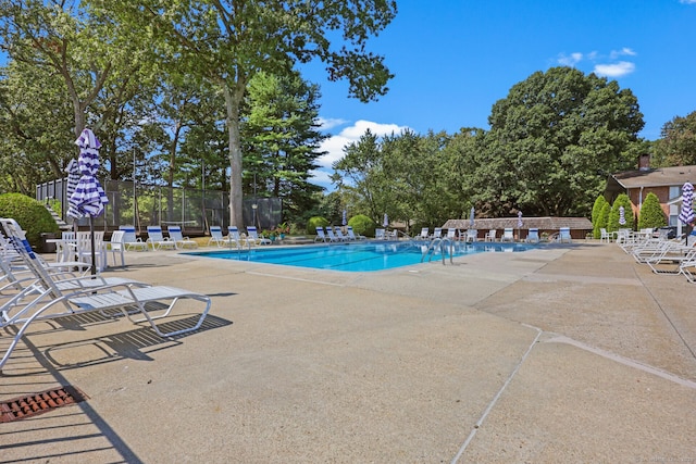 195 Southport Woods Dr Unit 195, Fairfield, CT 06890 - community pool with a patio and view of scattered trees