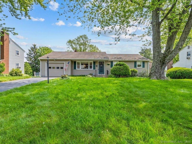 55 Oxbow Dr, Meriden, CT 06450 - single story home with a garage, asphalt driveway, and a front yard