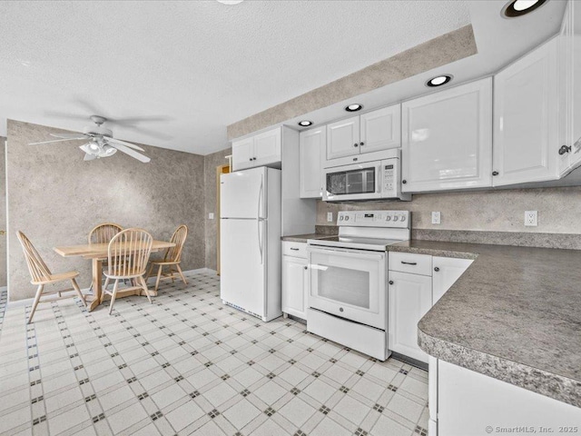 55 Oxbow Dr, Meriden, CT 06450 - kitchen featuring white appliances, white cabinetry, ceiling fan, light floors, and a textured ceiling