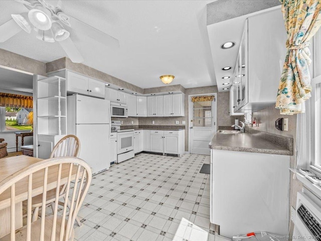 55 Oxbow Dr, Meriden, CT 06450 - kitchen featuring white appliances, plenty of natural light, white cabinets, and recessed lighting