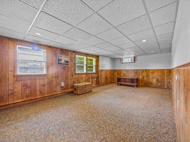 55 Oxbow Dr, Meriden, CT 06450 - unfurnished room featuring a drop ceiling, wooden walls, wainscoting, and carpet flooring