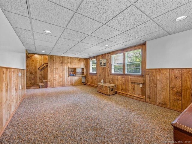 55 Oxbow Dr, Meriden, CT 06450 - basement with wooden walls, stairs, wainscoting, a paneled ceiling, and recessed lighting