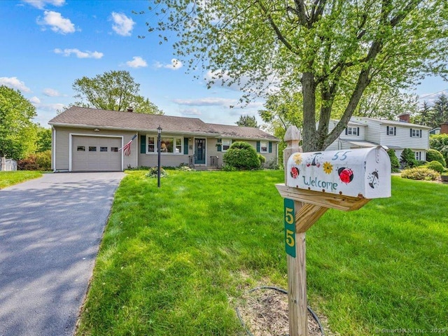 55 Oxbow Dr, Meriden, CT 06450 - ranch-style house featuring a garage, driveway, and a front yard