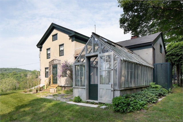 163 Dublin Rd, Canaan, CT 06031 - view of front facade featuring an exterior structure, stucco siding, entry steps, and an outbuilding