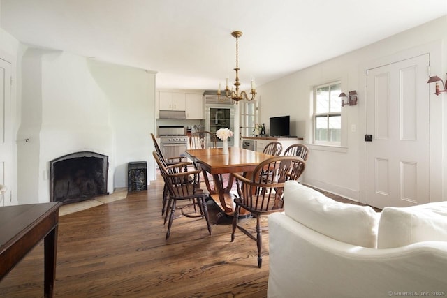 163 Dublin Rd, Canaan, CT 06031 - dining area with a fireplace, dark wood-style floors, and a chandelier