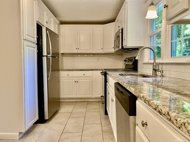 80 Murlyn Rd, Hamden, CT 06518 - kitchen featuring appliances with stainless steel finishes, white cabinets, backsplash, light stone counters, and light tile patterned flooring
