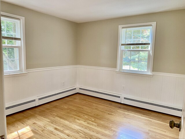 80 Murlyn Rd, Hamden, CT 06518 - unfurnished room featuring a wainscoted wall, plenty of natural light, and wood finished floors
