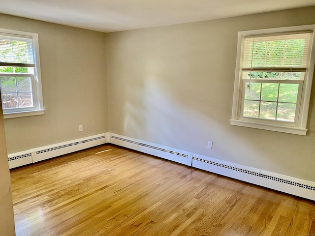 80 Murlyn Rd, Hamden, CT 06518 - empty room featuring baseboard heating and wood finished floors