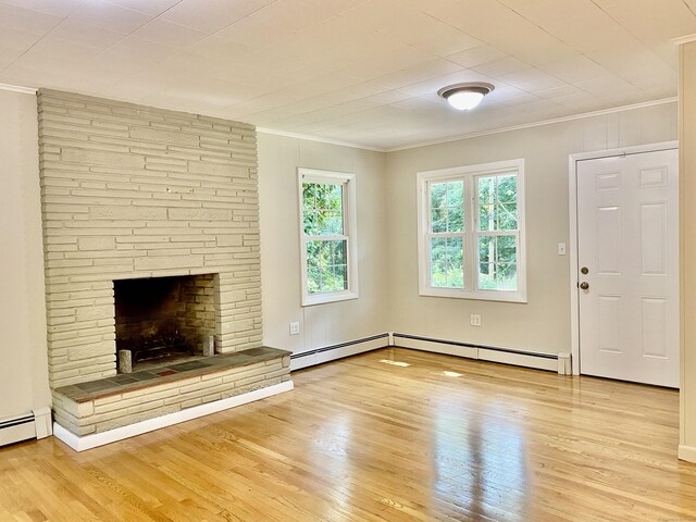 80 Murlyn Rd, Hamden, CT 06518 - unfurnished living room with ornamental molding, wood finished floors, and baseboard heating