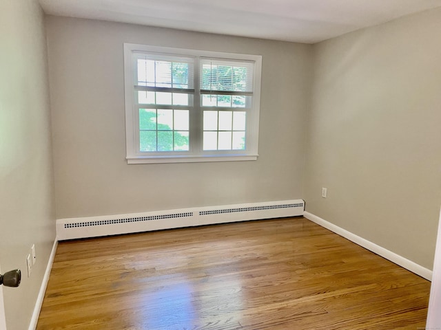 80 Murlyn Rd, Hamden, CT 06518 - unfurnished room featuring a baseboard radiator and wood finished floors