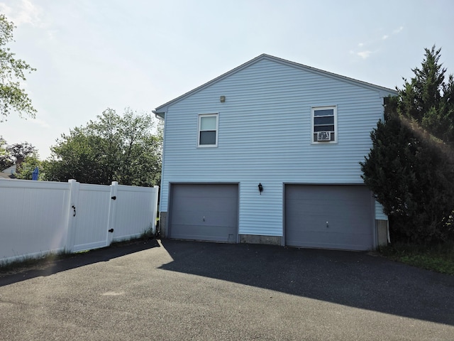 23 Teach St, Enfield, CT 06082 - view of side of property featuring a garage and a gate
