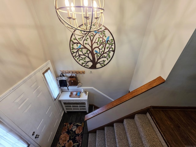 23 Teach St, Enfield, CT 06082 - stairs featuring a chandelier, wood finished floors, and a high ceiling