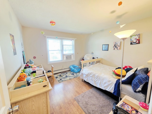23 Teach St, Enfield, CT 06082 - bedroom with wood finished floors and baseboard heating