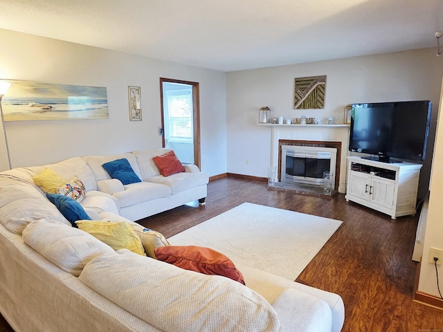 23 Teach St, Enfield, CT 06082 - living room with dark wood-style flooring and a glass covered fireplace