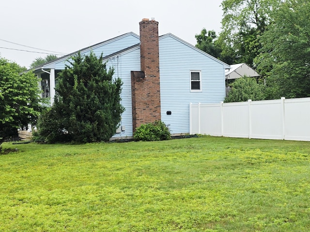 23 Teach St, Enfield, CT 06082 - view of property exterior with a chimney
