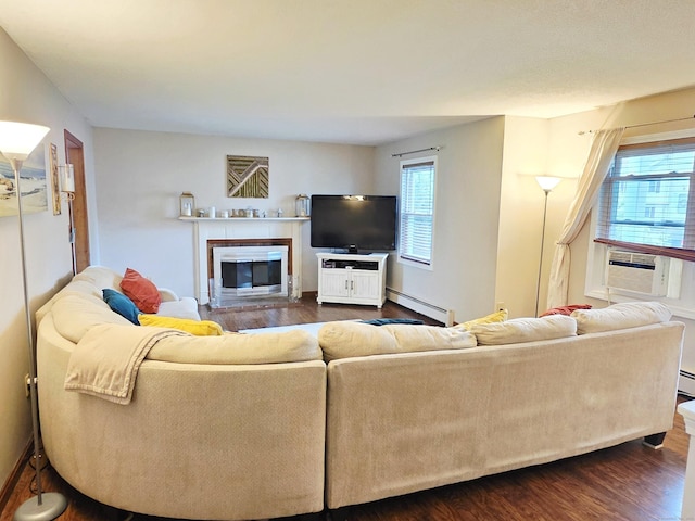 23 Teach St, Enfield, CT 06082 - living area featuring healthy amount of natural light, cooling unit, dark wood-type flooring, and a baseboard radiator