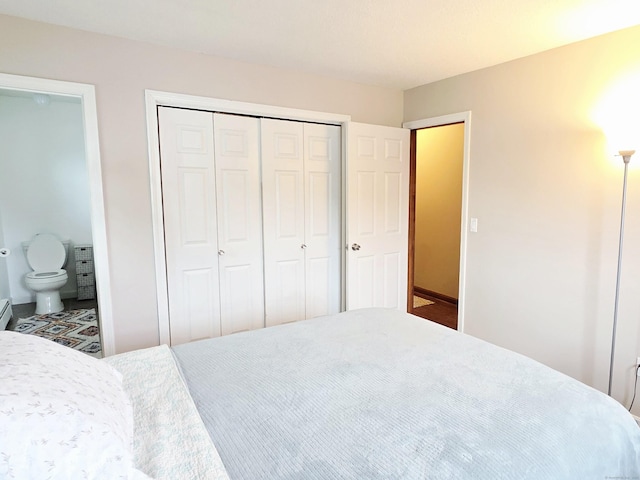 23 Teach St, Enfield, CT 06082 - bedroom featuring a closet, ensuite bathroom, and a baseboard heating unit