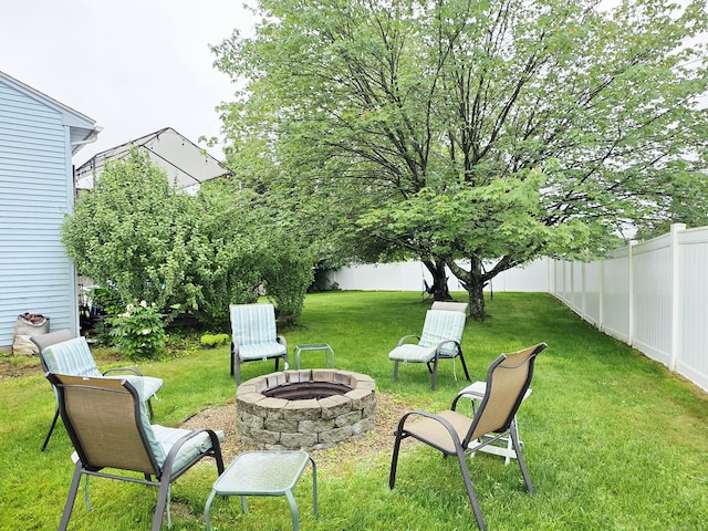 23 Teach St, Enfield, CT 06082 - fenced backyard with a fire pit